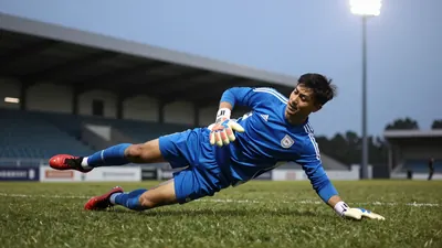 Wigan Athletic's Under-21s beat Bolton Wanderers 3-1 despite playing with ten men for the final half-hour to stay top of...